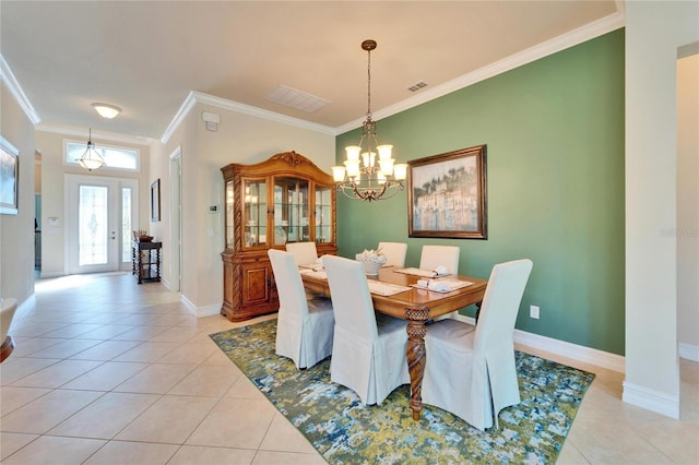 dining area with light tile patterned flooring, a chandelier, baseboards, and ornamental molding