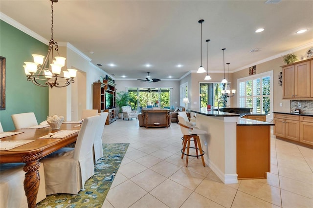 kitchen featuring dark countertops, open floor plan, light tile patterned flooring, and tasteful backsplash