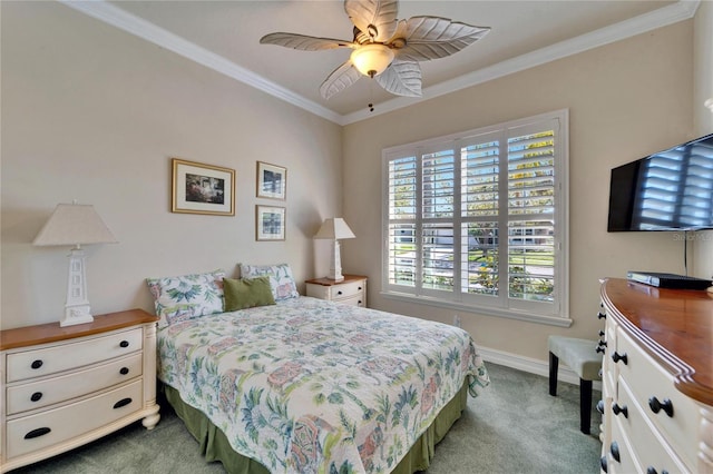 carpeted bedroom featuring a ceiling fan, baseboards, and ornamental molding