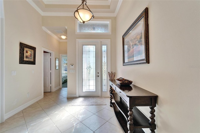 entryway featuring light tile patterned floors, baseboards, and ornamental molding