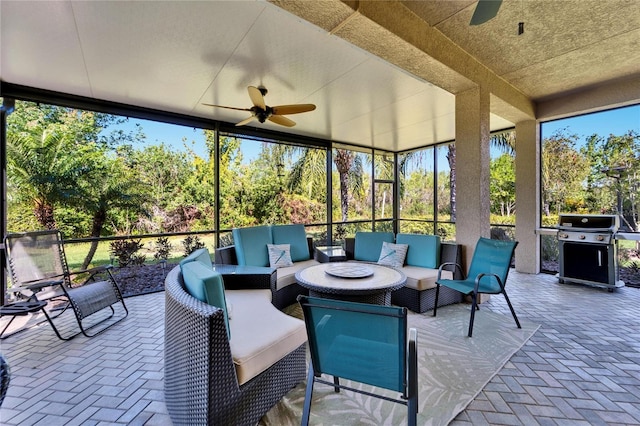 view of patio with grilling area, outdoor lounge area, and ceiling fan