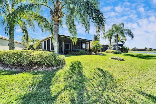 view of yard featuring a sunroom