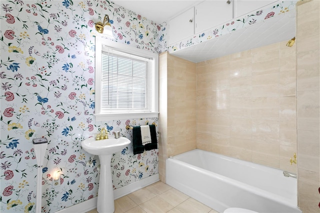 full bathroom with a tub to relax in, tile patterned flooring, baseboards, and wallpapered walls