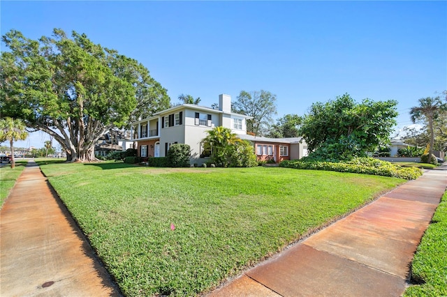 exterior space featuring a lawn and stucco siding