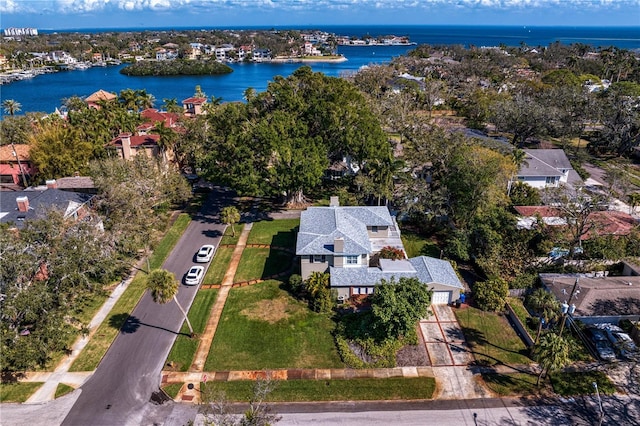 birds eye view of property with a water view