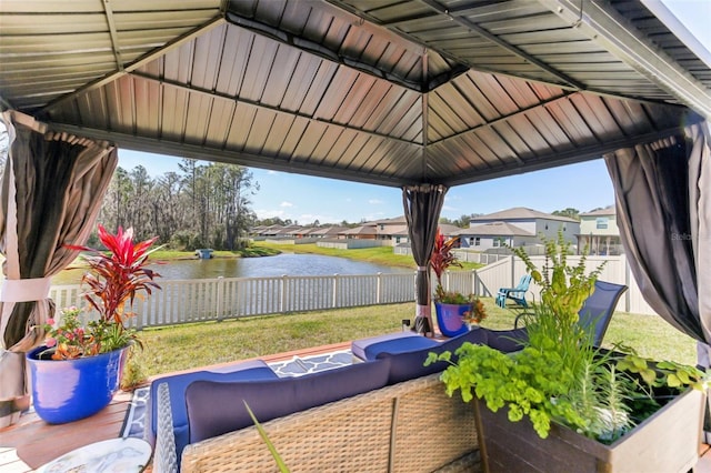 view of patio / terrace featuring a gazebo and a water view