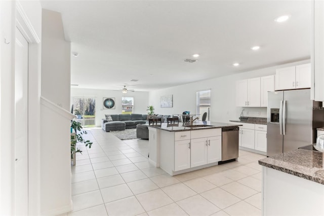 4323 Trotters Way, Lakeland, FL 33801 - kitchen featuring sink, light tile patterned flooring, white cabinets, and appliances with stainless steel finishes
