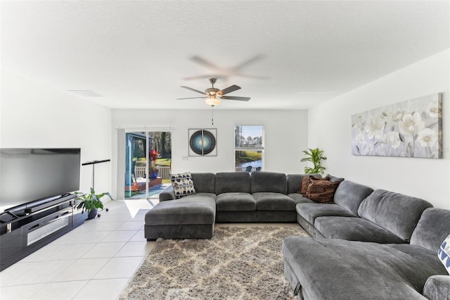 4323 Trotters Way, Lakeland, FL 33801 - living room with ceiling fan, a textured ceiling, and light tile patterned floors
