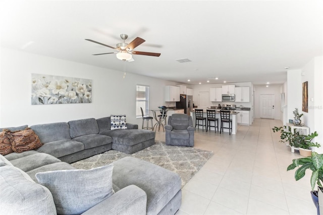 4323 Trotters Way, Lakeland, FL 33801 - living room featuring light tile patterned floors and ceiling fan