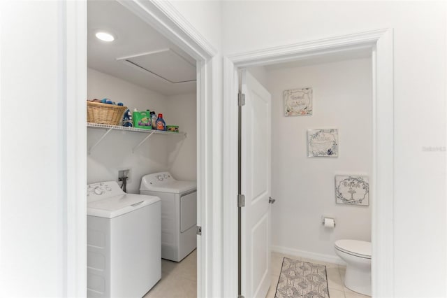 4323 Trotters Way, Lakeland, FL 33801 - laundry room with light tile patterned floors and washer and clothes dryer