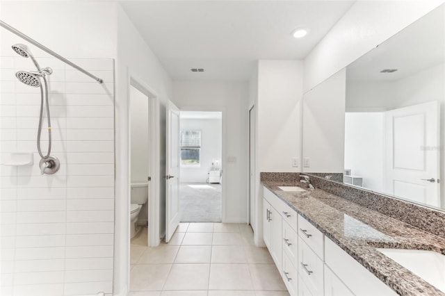 4323 Trotters Way, Lakeland, FL 33801 - bathroom with tile patterned floors, vanity, toilet, and a tile shower