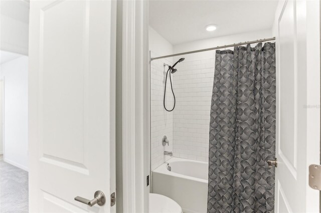 4323 Trotters Way, Lakeland, FL 33801 - bathroom featuring shower / bathtub combination with curtain and toilet