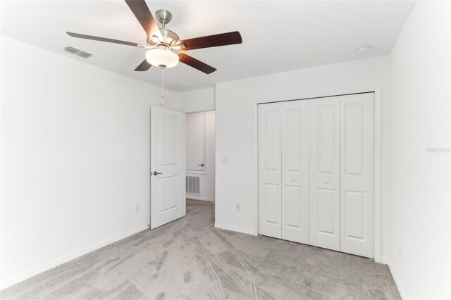 4323 Trotters Way, Lakeland, FL 33801 - unfurnished bedroom featuring light colored carpet, ceiling fan, and a closet
