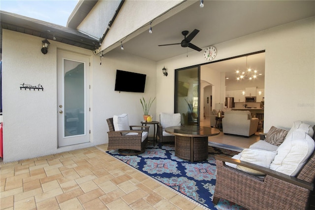 view of patio with an outdoor hangout area and ceiling fan