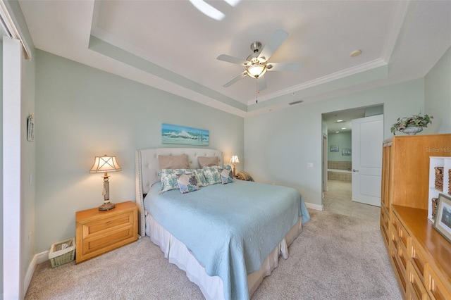 carpeted bedroom featuring ceiling fan and a raised ceiling