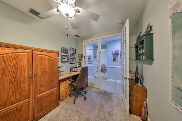 office area with light carpet, french doors, and ceiling fan