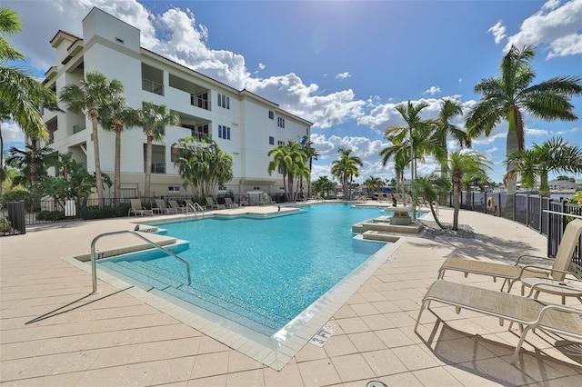 view of swimming pool with a patio