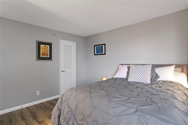 bedroom with hardwood / wood-style flooring