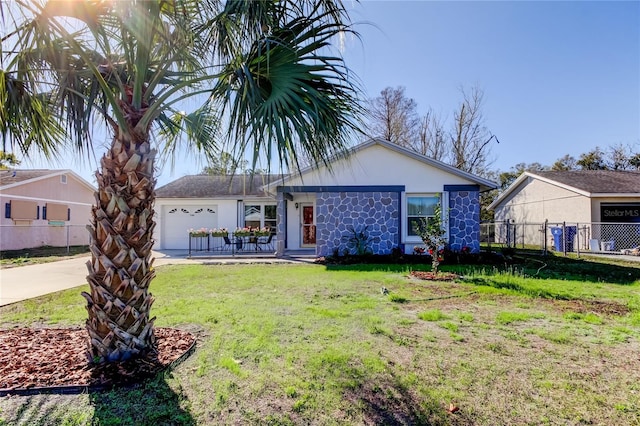 ranch-style home featuring a garage and a front yard