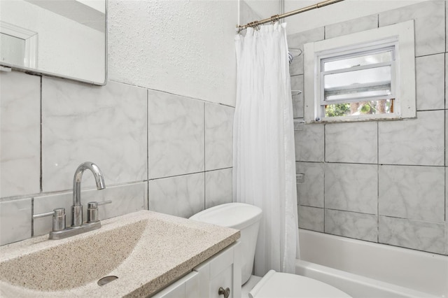 full bathroom with toilet, tile walls, vanity, shower / bathtub combination with curtain, and backsplash