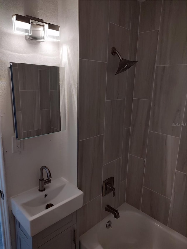 full bathroom featuring bathtub / shower combination and vanity