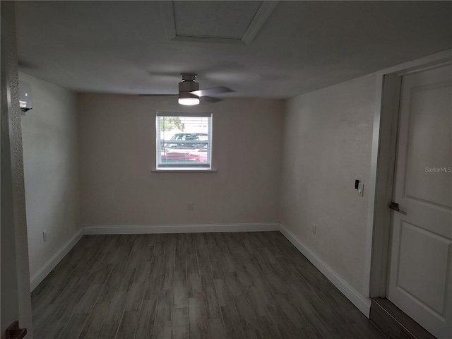 unfurnished room featuring wood finished floors and baseboards