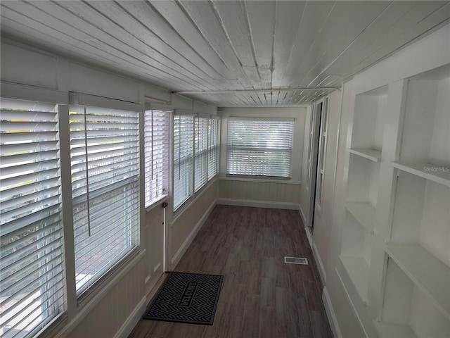 hall featuring wood ceiling, mail area, visible vents, and wood finished floors