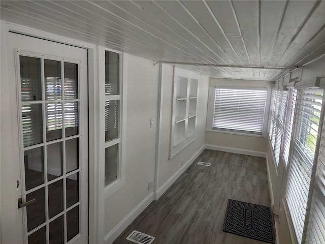 unfurnished sunroom with visible vents