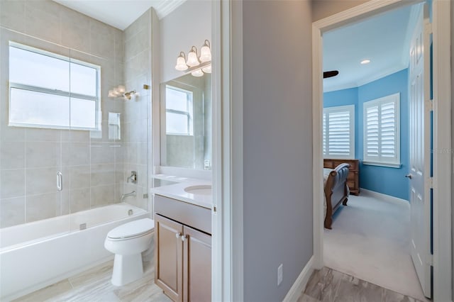 bathroom featuring crown molding, shower / tub combination, a wealth of natural light, and vanity