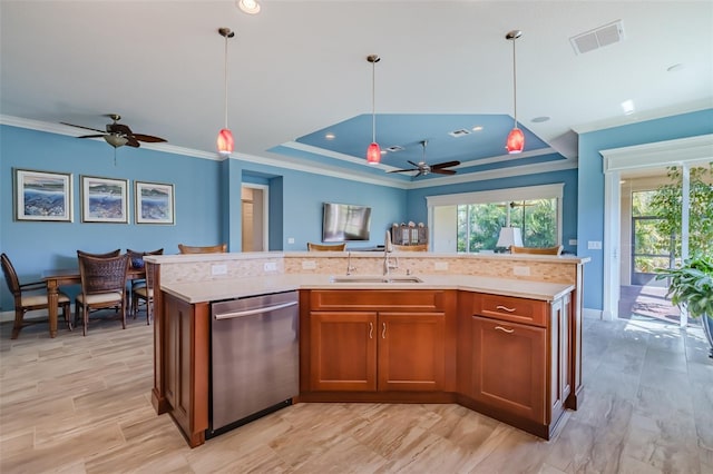 kitchen featuring a sink, brown cabinetry, stainless steel dishwasher, and light countertops