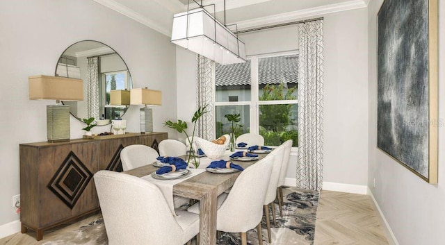 dining area with ornamental molding and light parquet floors