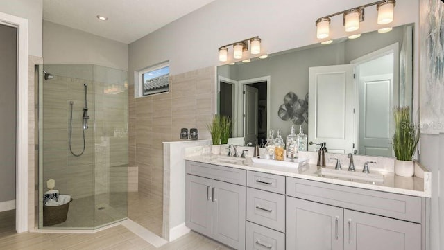 bathroom featuring vanity and a tile shower