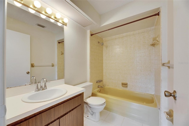 full bathroom featuring vanity, tiled shower / bath combo, tile patterned floors, and toilet