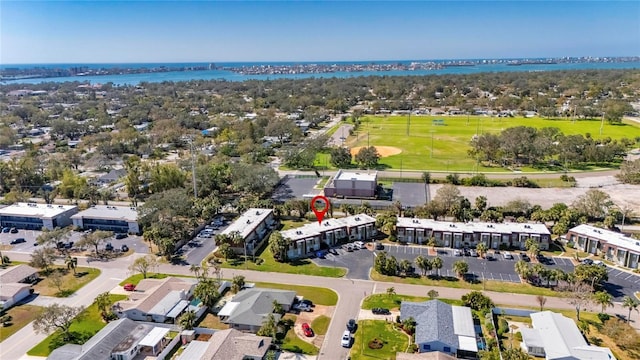 birds eye view of property featuring a water view