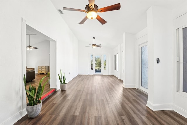 unfurnished living room with lofted ceiling and dark hardwood / wood-style flooring