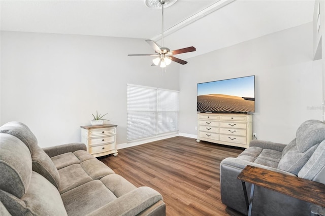 living room with lofted ceiling, ceiling fan, and wood-type flooring