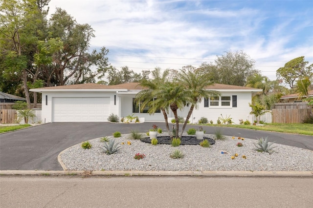 ranch-style home with a garage