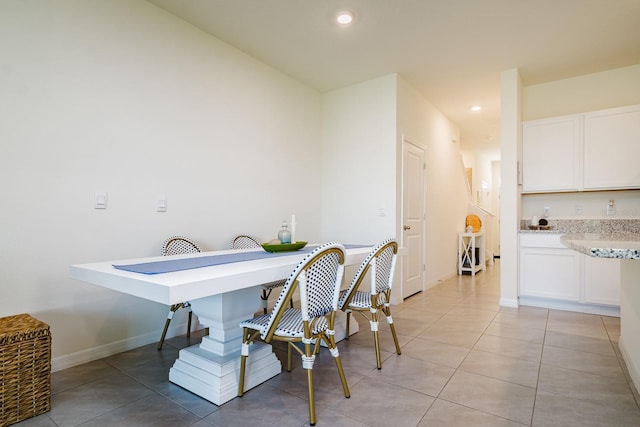 dining space with light tile patterned floors