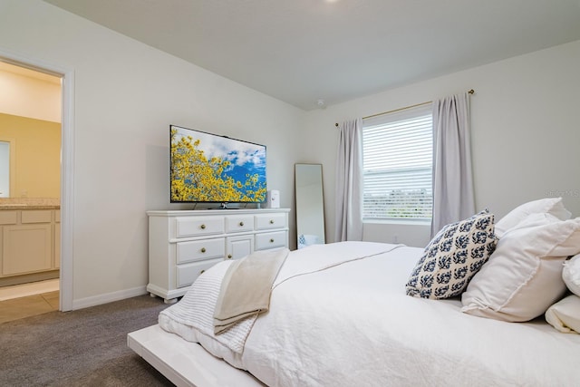 carpeted bedroom with ensuite bathroom