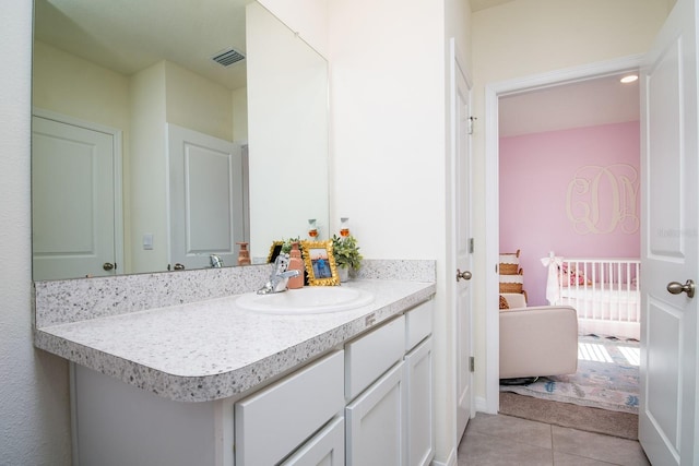 bathroom with vanity and tile patterned floors