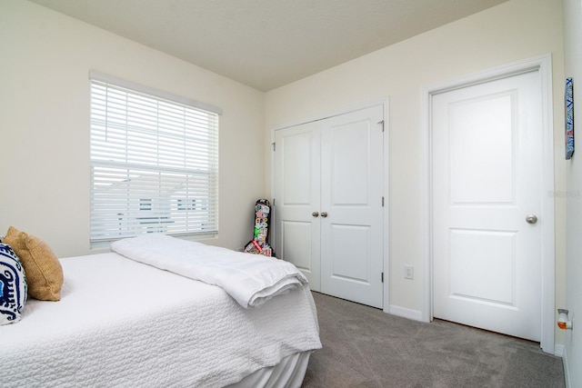 carpeted bedroom with a closet