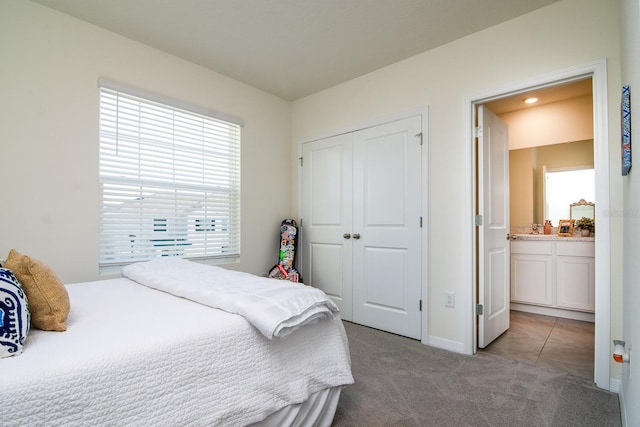 carpeted bedroom featuring a closet