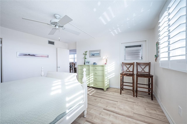 bedroom featuring light hardwood / wood-style floors and ceiling fan