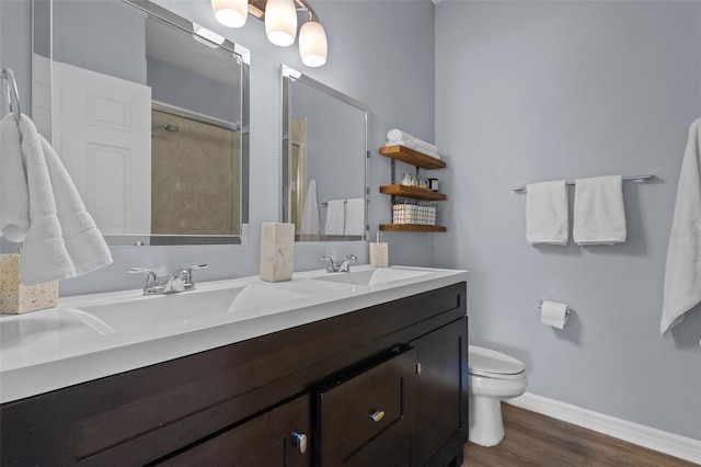 bathroom featuring an enclosed shower, hardwood / wood-style floors, vanity, and toilet