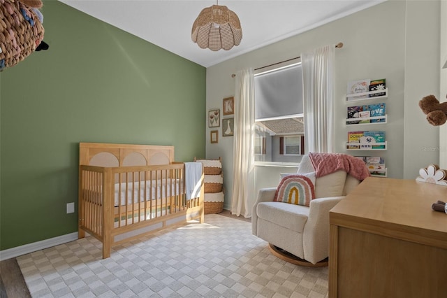 bedroom featuring a nursery area