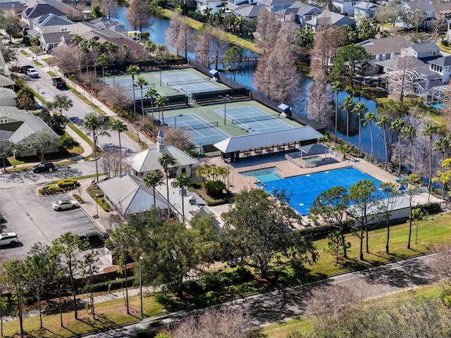 birds eye view of property with a water view