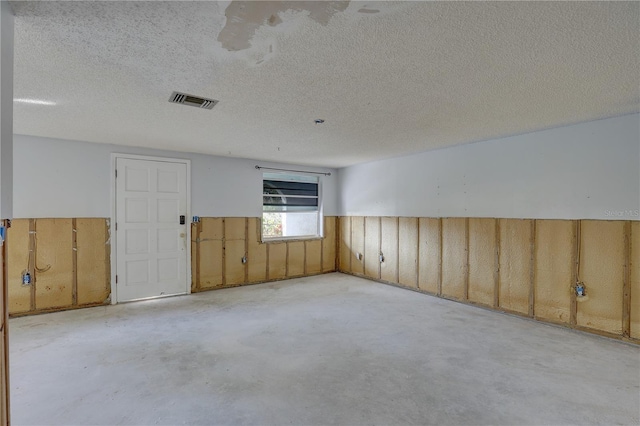 empty room with a textured ceiling