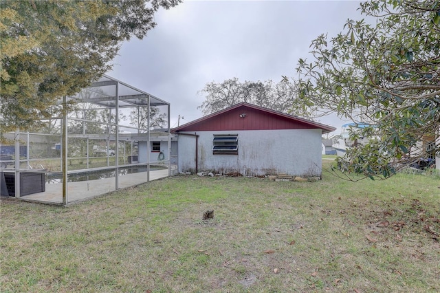 rear view of house featuring a yard