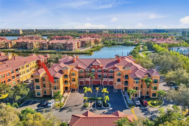 birds eye view of property with a water view