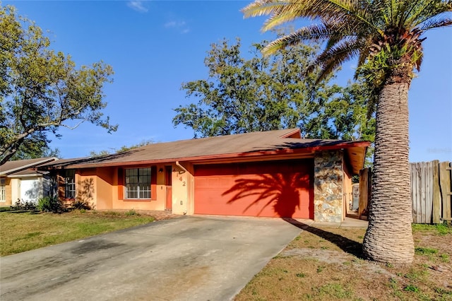 view of front of home featuring a garage and a front lawn